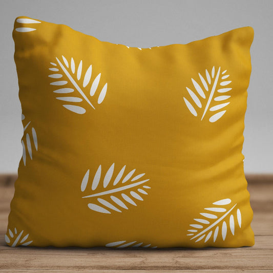 Mustard yellow cushion cover with white leaf pattern on modern decorative pillow