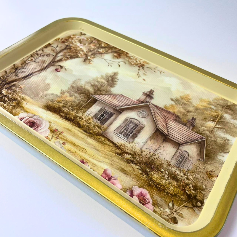 Rectangular serving tray with vintage cottage landscape, floral details, and gold-toned border