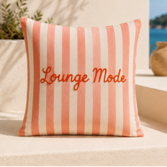 Pink and white striped decorative cushion cover with Lounge Mode text in elegant script lettering