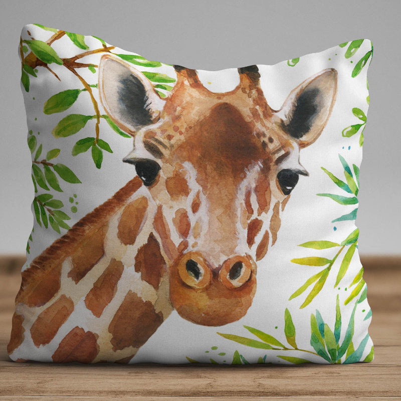 Watercolor giraffe cushion cover with botanical leaves on a decorative white pillow