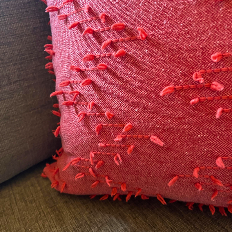 Polka Zigzag Collection – 43x43 cm coral embroidered cushion cover on beige sofa