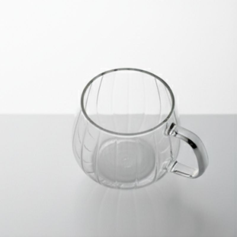 Double-wall glass coffee mug with handle, empty
Heat-resistant clear glass coffee cup for espresso or tea
Modern borosilicate glass mug on white background
Transparent insulated glass mug with ergonomic handle