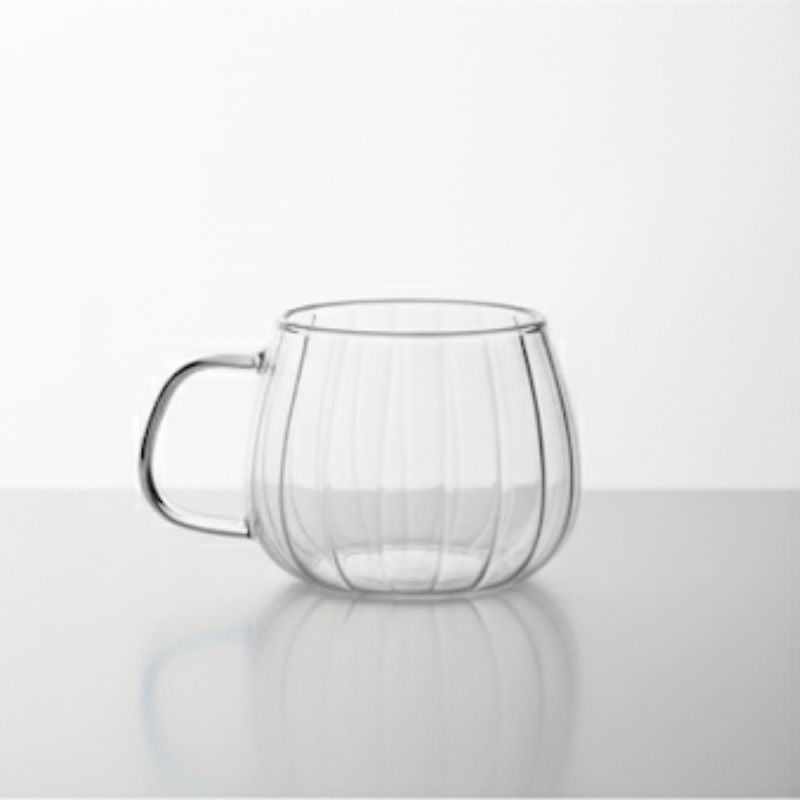 Double-wall glass coffee mug with handle, empty
Heat-resistant clear glass coffee cup for espresso or tea
Modern borosilicate glass mug on white background
Transparent insulated glass mug with ergonomic handle