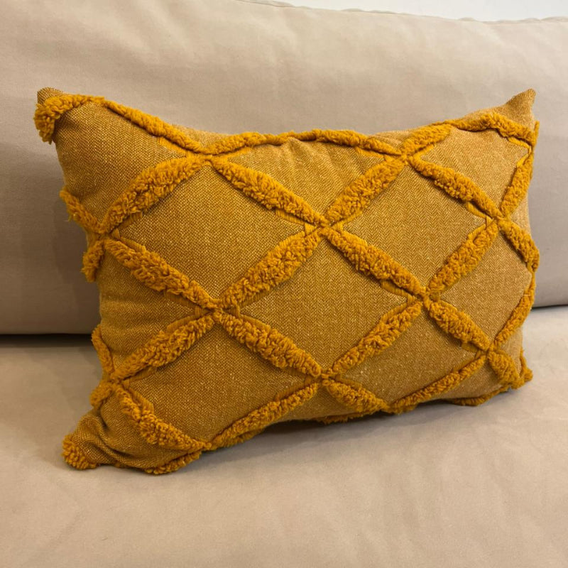 Burnt Orange textured decorative cushion cover with raised diamond pattern on beige sofa