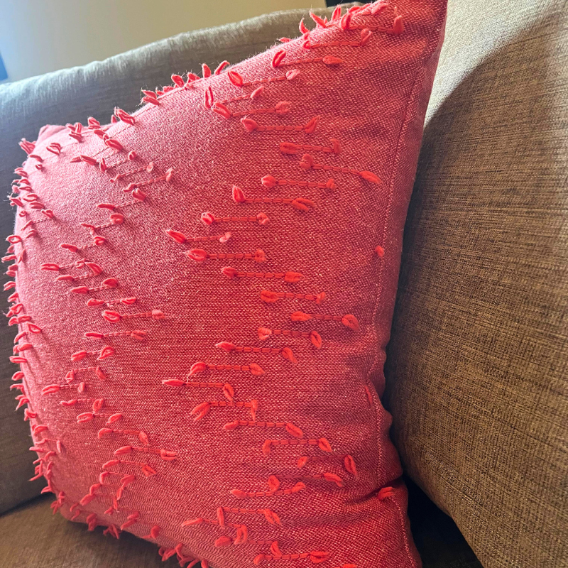 Polka Zigzag Collection – 43x43 cm coral embroidered cushion cover on beige sofa