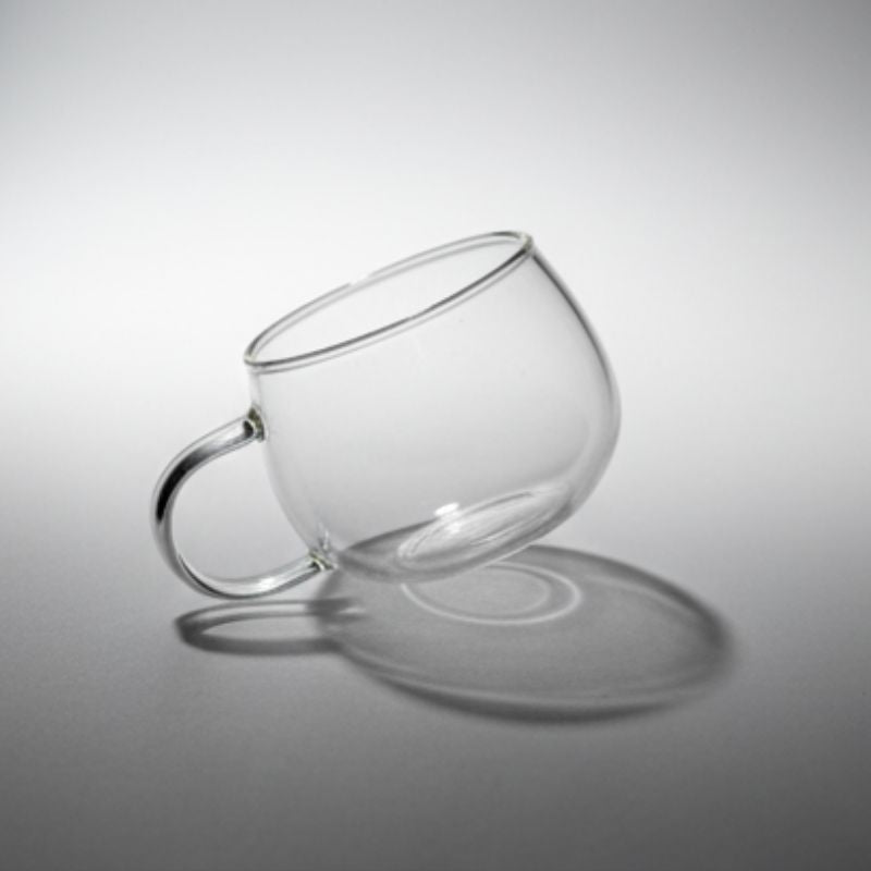 Rounded clear glass mug with handle – bubble design transparent coffee cup”
“Minimalist clear glass tea cup with smooth round shape”
“Modern rounded bubble glass mug for coffee or tea”
“Transparent glass coffee cup with rounded body and handle”
“Contemporary clear glass mug showcasing minimalist drinkware design”