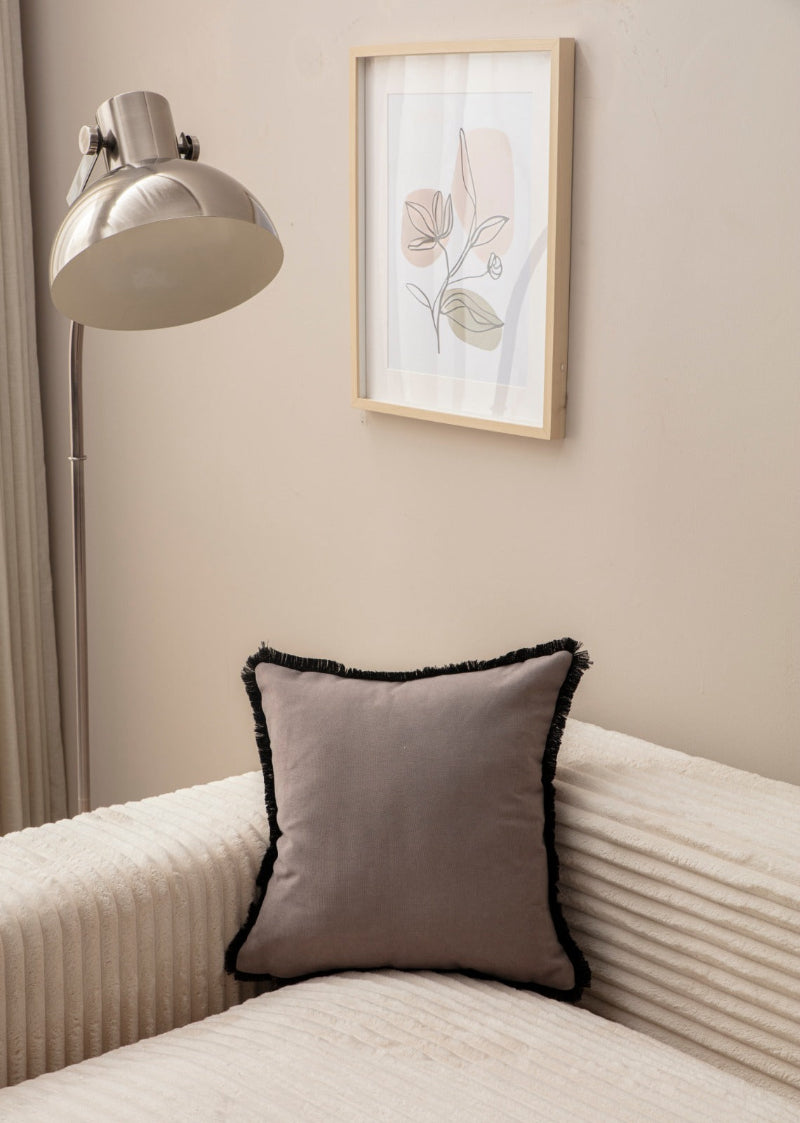 Taupe cushion cover with black fringe on sofa – 43x43 cm
Pair of taupe and black fringe cushions styled for modern décor
Close-up of taupe cushion with bold black trim edges
Decorative pillow in taupe with black fringe for living room décor