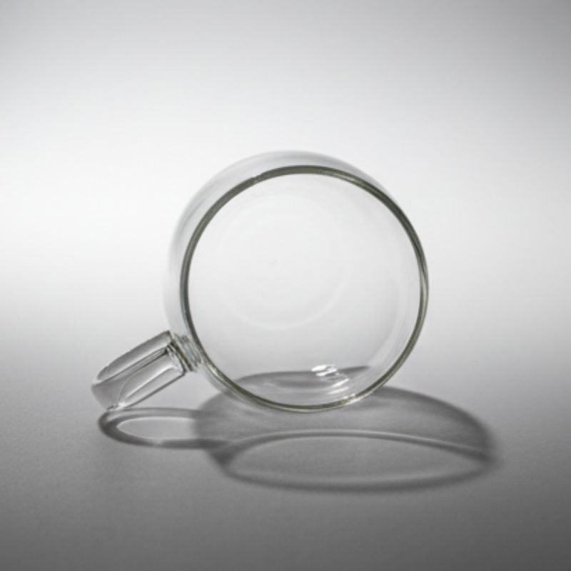 Rounded clear glass mug with handle – bubble design transparent coffee cup”
“Minimalist clear glass tea cup with smooth round shape”
“Modern rounded bubble glass mug for coffee or tea”
“Transparent glass coffee cup with rounded body and handle”
“Contemporary clear glass mug showcasing minimalist drinkware design”