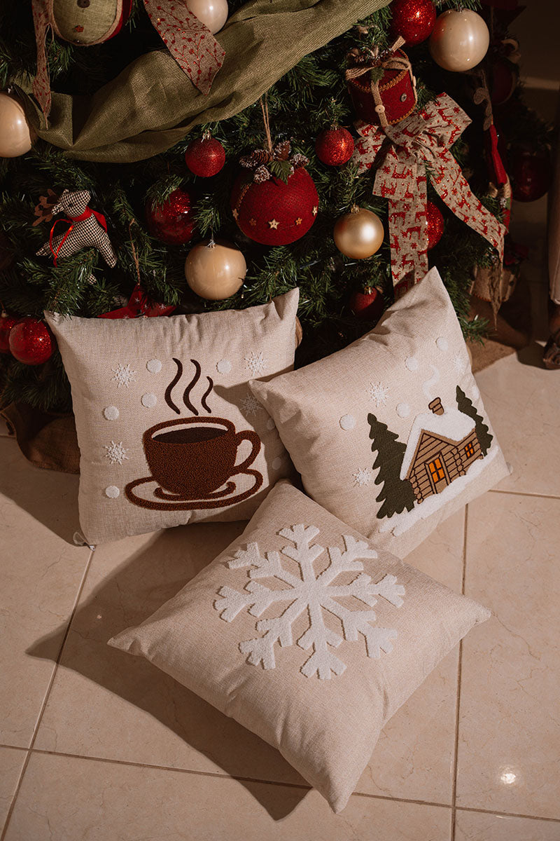 Beige cushion with brown embroidered steaming coffee cup on a blue sofa – Autumn Bloom Collection
