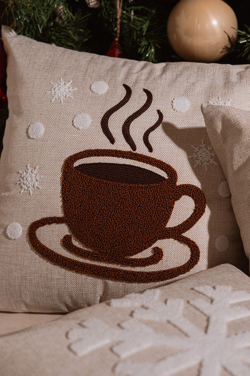 Beige cushion with brown embroidered steaming coffee cup on a blue sofa – Autumn Bloom Collection