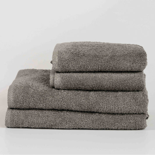 Absorbent stone grey cotton towel folded neatly.