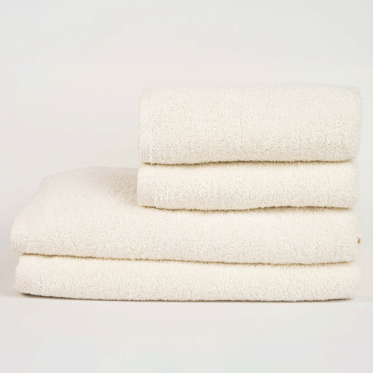 Absorbent cream cotton towel folded neatly.