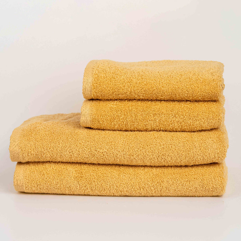 Absorbent honey yellow cotton towel folded neatly.