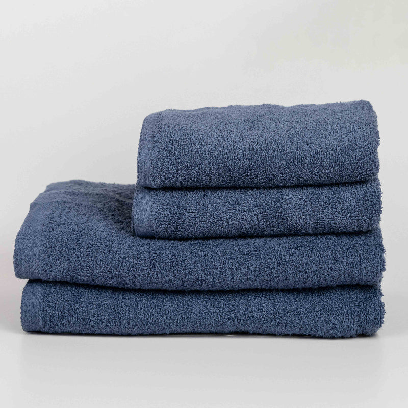 Absorbent indigo blue cotton towel folded neatly.