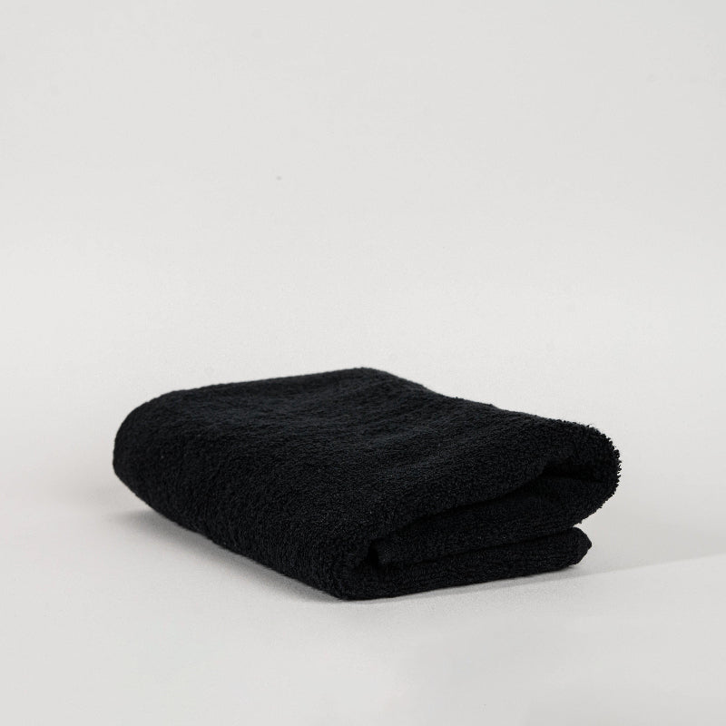 Absorbent pastel green cotton towel folded neatly.