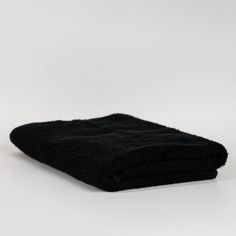 Absorbent pastel green cotton towel folded neatly.