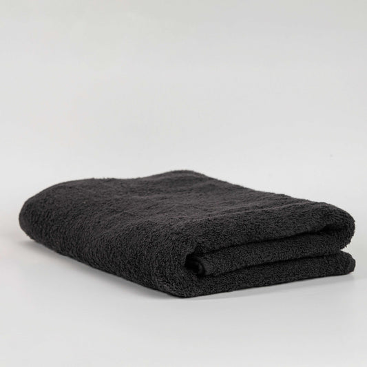 Absorbent dark grey cotton towel folded neatly.