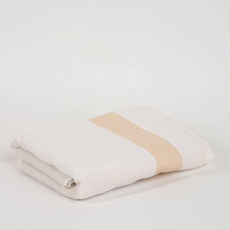 Beige: "White cotton towel with beige border – luxury absorbent bathroom towel"
