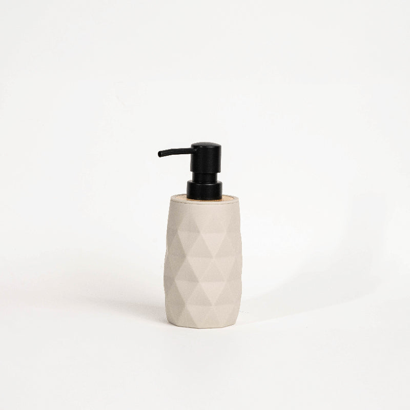 Set of four geometric soap dispensers in gray, white, beige, and black with bamboo detail