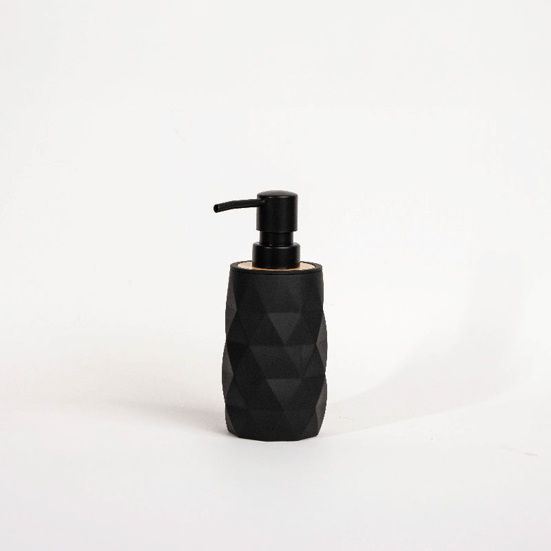 Set of four geometric soap dispensers in gray, white, beige, and black with bamboo detail
