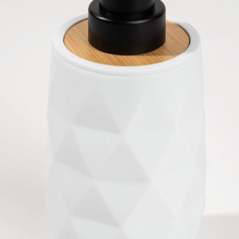 Set of four geometric soap dispensers in gray, white, beige, and black with bamboo detail