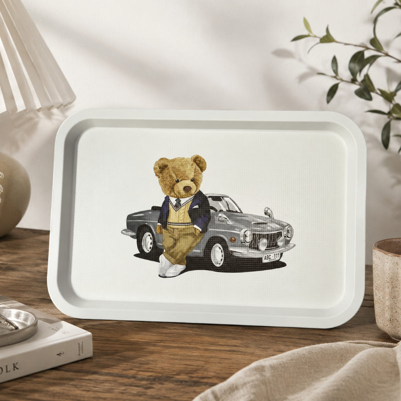 Tray with a teddy bear and car illustration on a white background