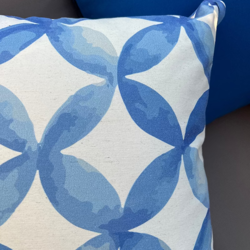 Blue geometric circle pattern cushion cover with watercolor abstract design on decorative pillow