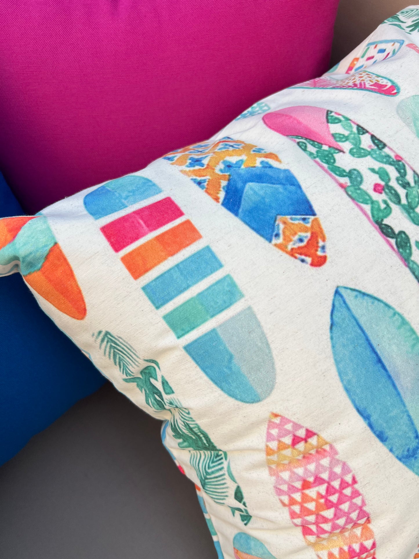 Colorful surfboard pattern cushion cover with tropical pastel designs on decorative pillow