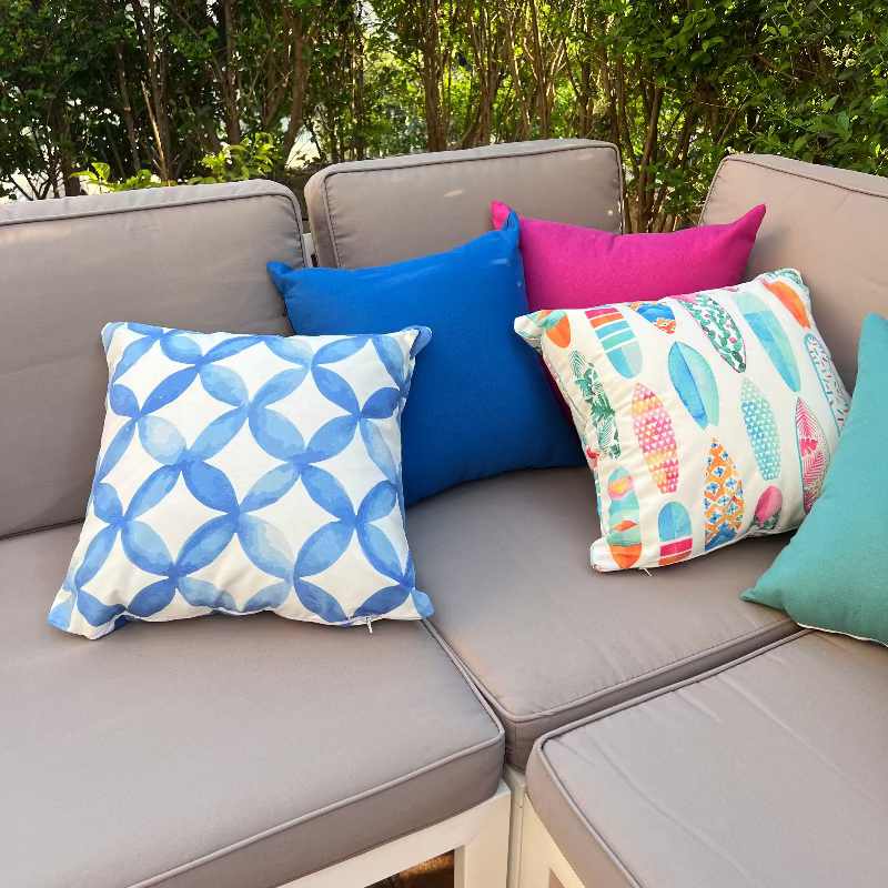 Colorful surfboard pattern cushion cover with tropical pastel designs on decorative pillow