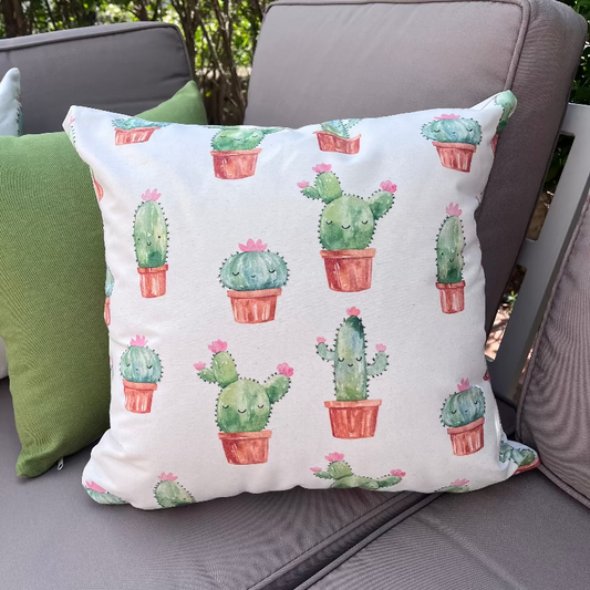 Cute cactus pattern cushion cover with repeating watercolor potted plants on decorative pillow