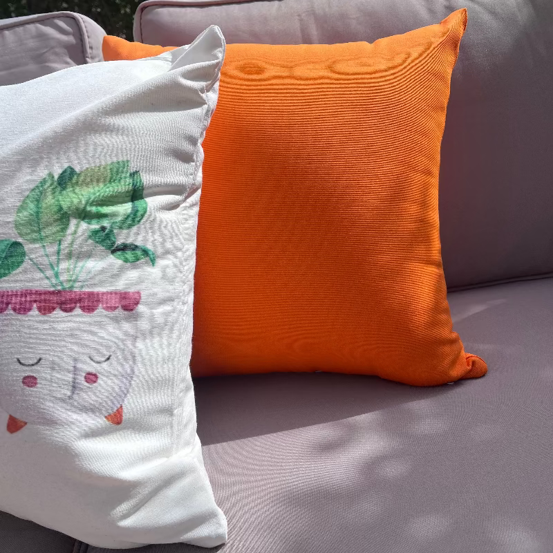 Cute plant face cushion cover with watercolor potted plant illustrations on a minimalist white decorative pillow