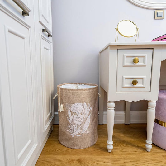 Close-up of purple felt laundry basket with “Enjoy Today” print
Round felt laundry basket with rope handles in bathroom
Stylish felt laundry bin with drawstring cover
Purple storage hamper with modern leaf design