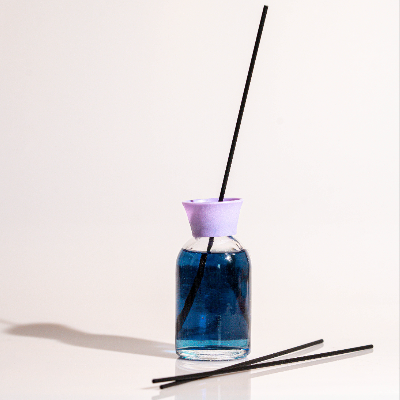 Elegant glass lavender reed diffuser with fragrance oil and natural sticks for home fragrance