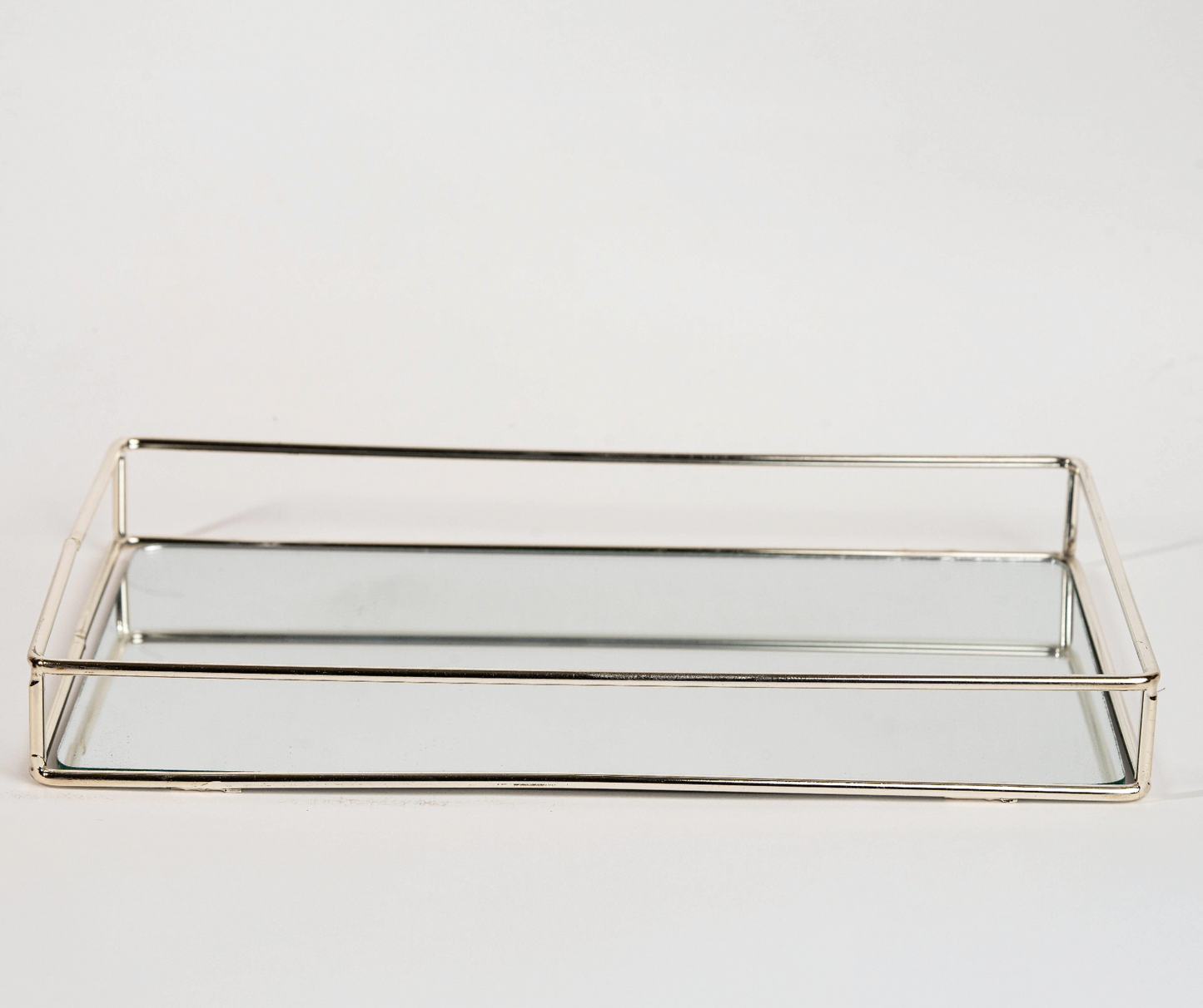 Elegant rectangular gold mirror tray with metal frame for home décor and serving"