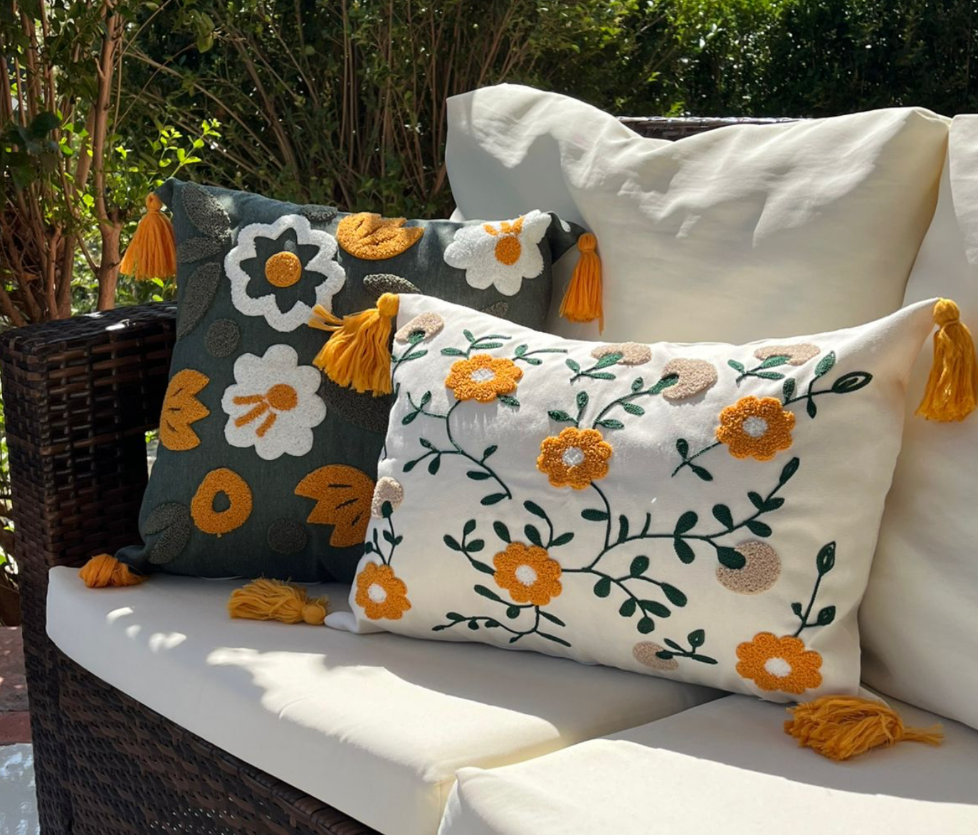 Olive Comfort Collection square floral embroidered cushion cover with white flowers, mustard centers, and mustard tassels on an olive green base – 43x43 cm decorative pillow