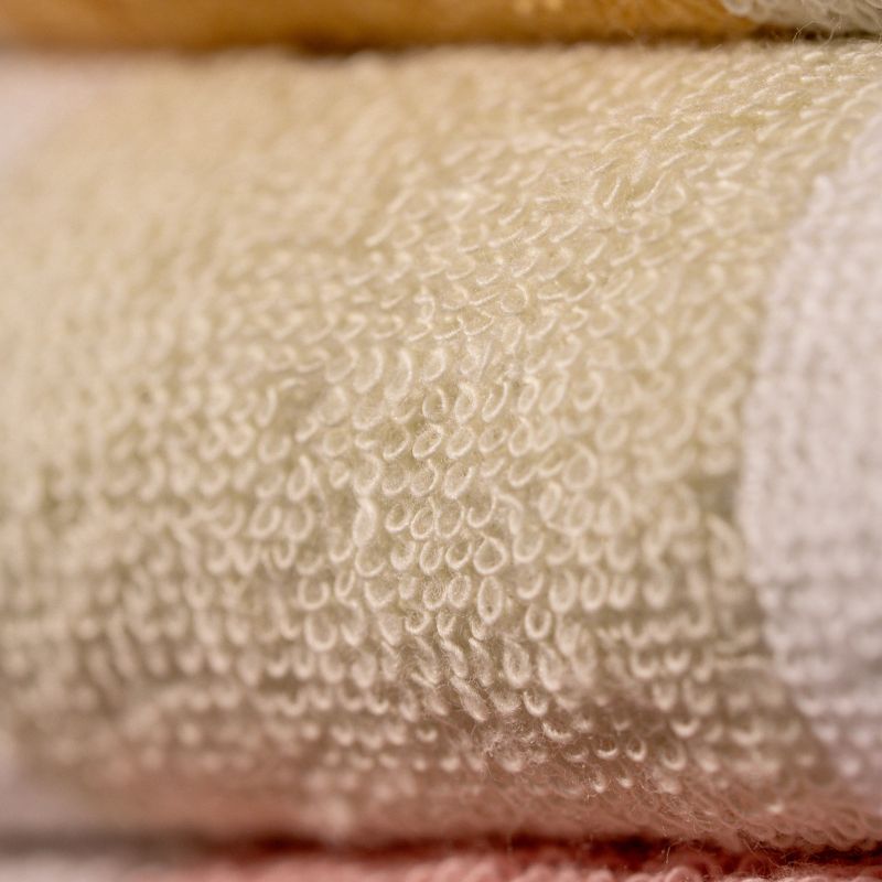 Beige: "White cotton towel with beige border – luxury absorbent bathroom towel"
