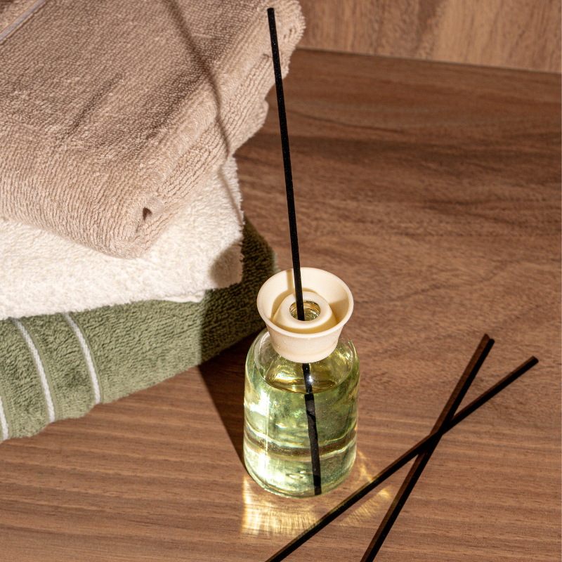 Elegant glass white soap reed diffuser with fragrance oil and natural sticks for home fragrance