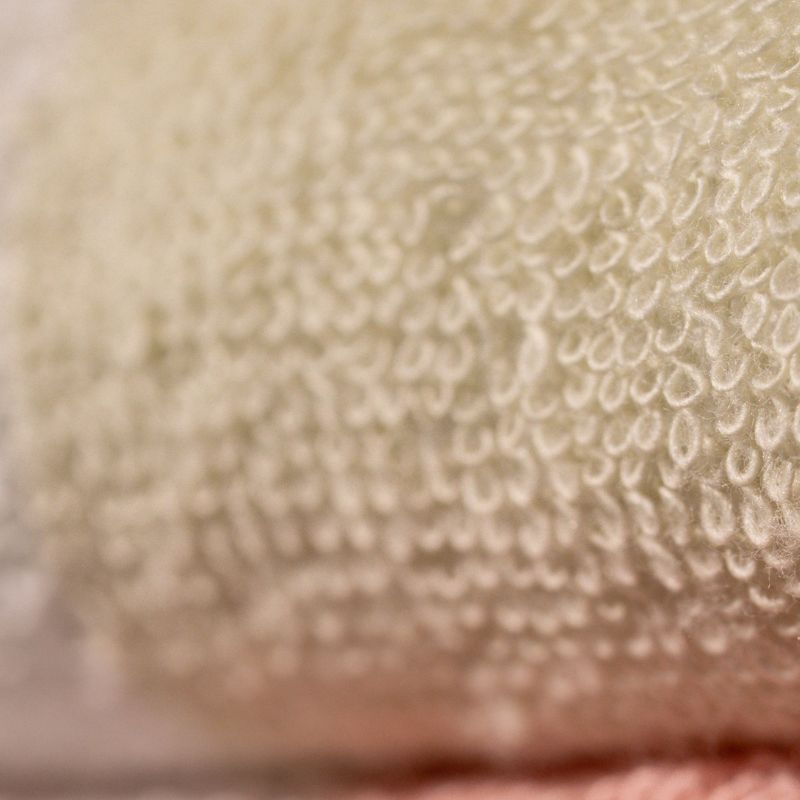 Green: "White cotton towel with green border – absorbent cotton bathroom towel"


