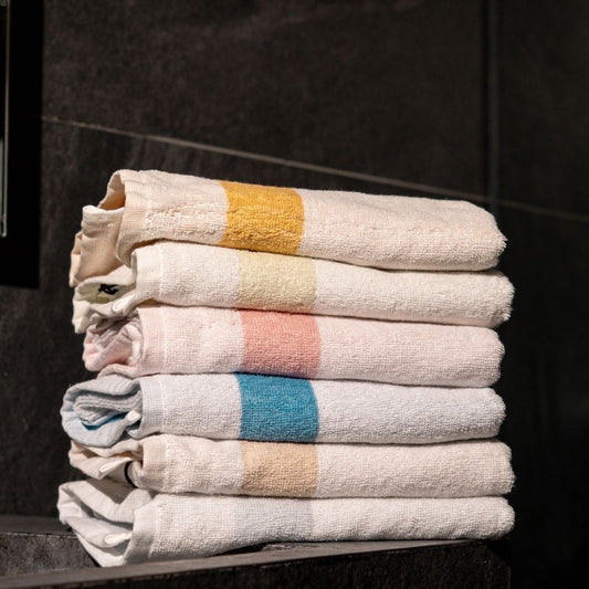 Yellow: "White cotton towel with yellow border – soft absorbent bathroom towel"

Green: "White cotton towel with green border – absorbent cotton bathroom towel"

Coral: "White cotton towel with coral border – decorative absorbent bathroom towel"

Blue: "White cotton towel with blue border – quick drying cotton towel"

Beige: "White cotton towel with beige border – luxury absorbent bathroom towel"

Grey: "White cotton towel with grey border – modern cotton bathroom towe
