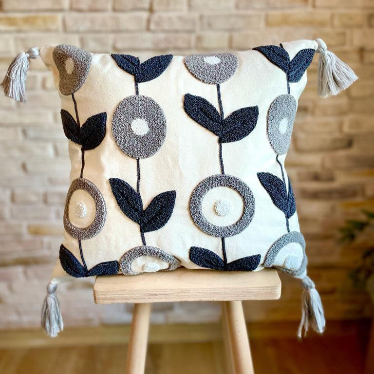 Nordic Bloom cushion cover with navy and grey floral embroidery and tassels