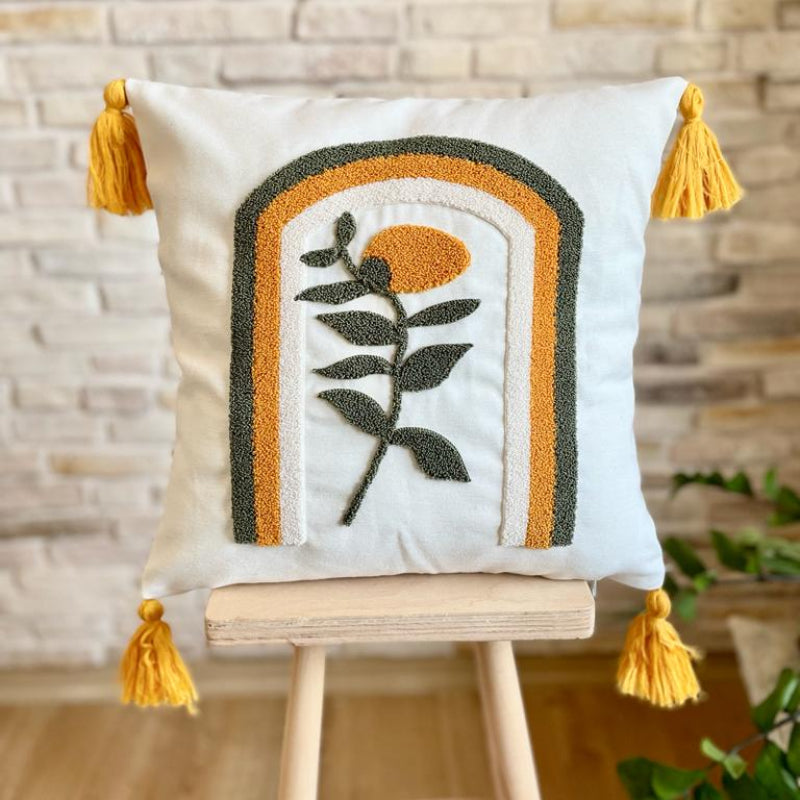Handcrafted throw pillow with embroidered floral design, yellow tassels, and pastel arches in orange and green.