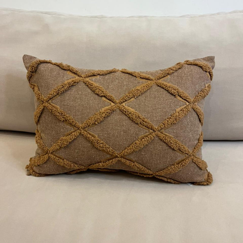 Mocha brown textured decorative cushion cover with raised diamond pattern on cream sofa