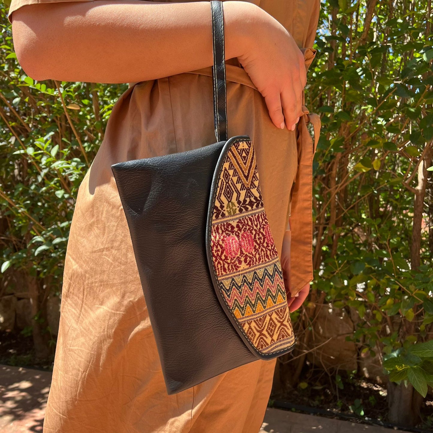 Elegant Black Leather Crossbody Bag with Ethnic Pattern Flap
