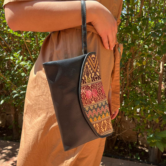 Elegant Black Leather Crossbody Bag with Ethnic Pattern Flap