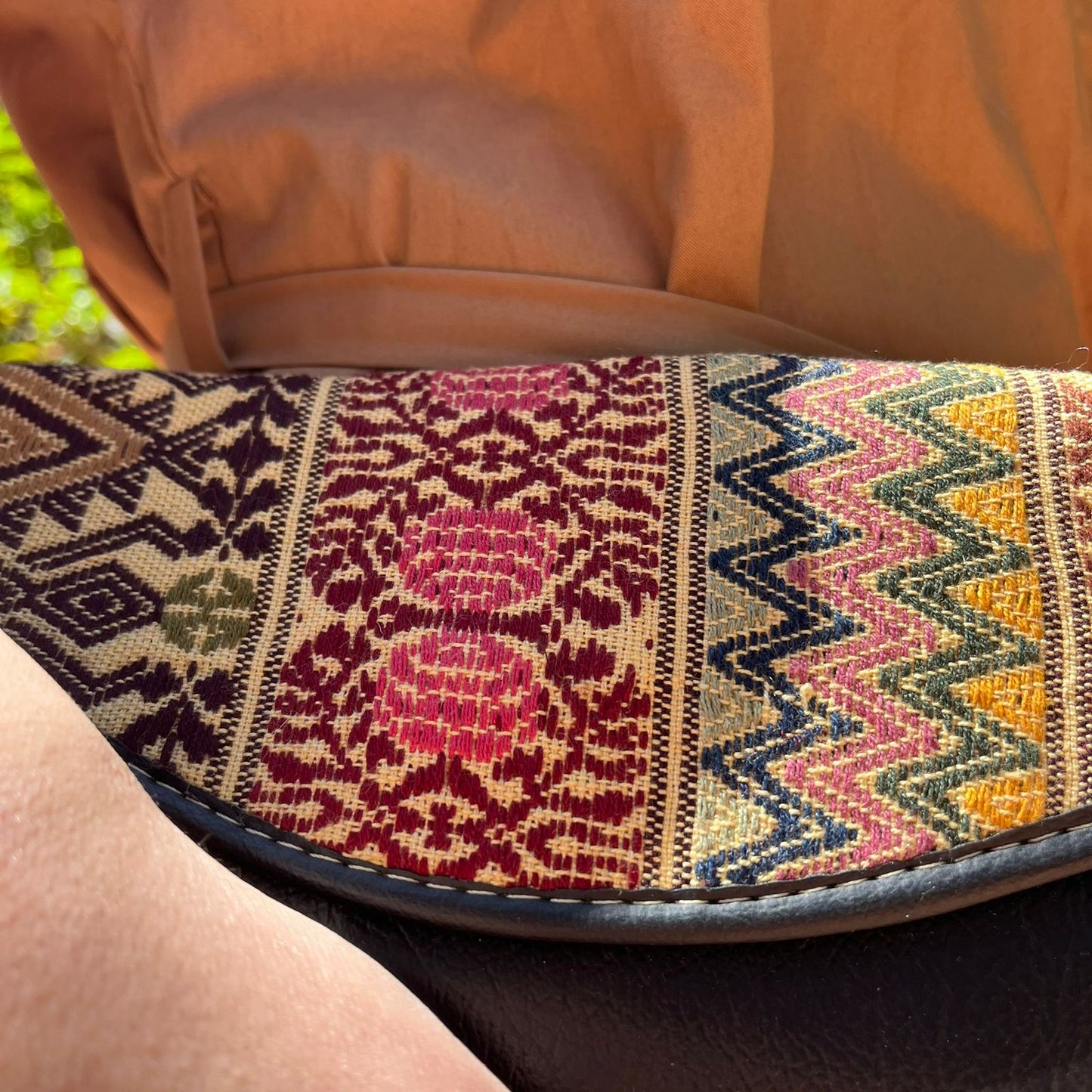 Elegant Black Leather Crossbody Bag with Ethnic Pattern Flap