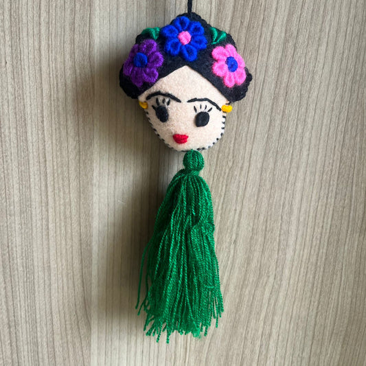 Handmade Frida Kahlo inspired felt ornament with embroidered flowers and green tassel hanging decor