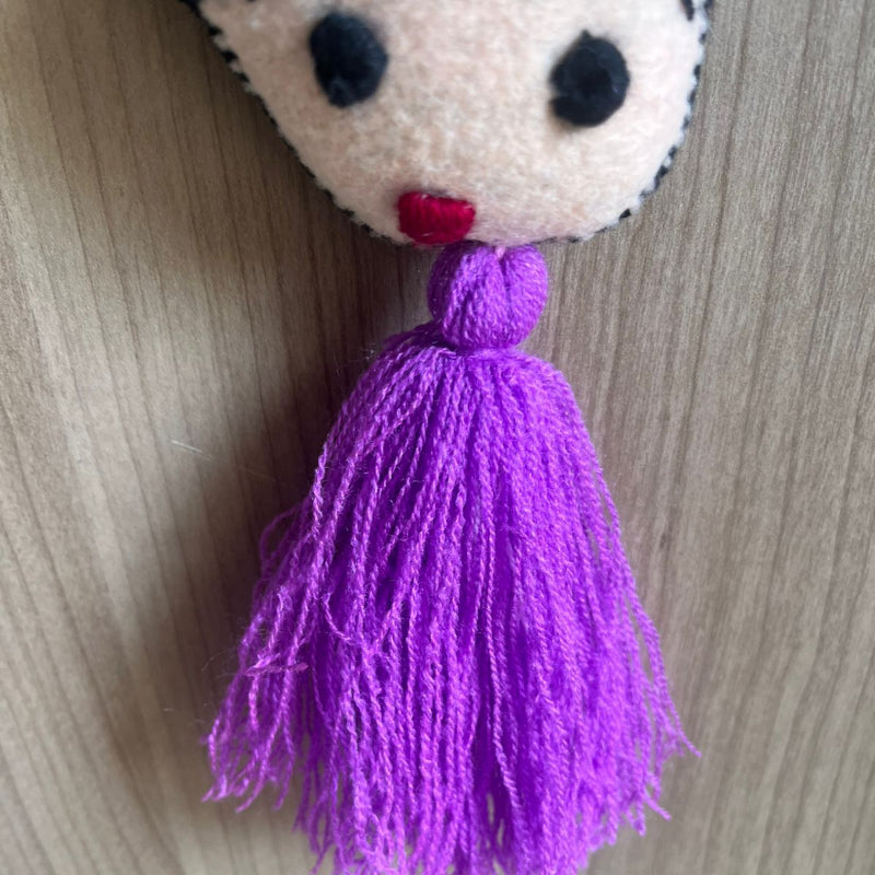 Handmade Frida Kahlo felt tassel ornament with colorful floral embroidery and purple tassel