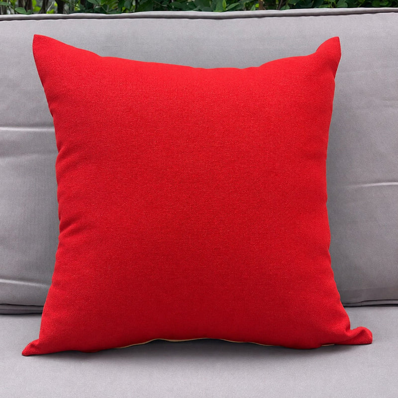 Red pillow on a gray sofa