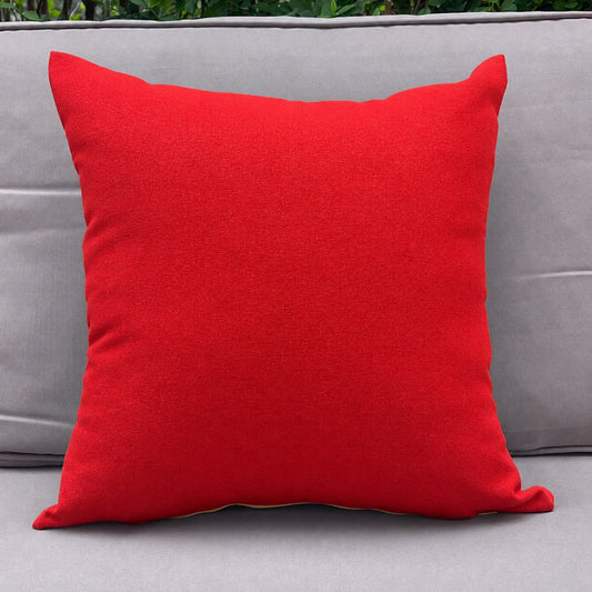 Red pillow on a gray sofa