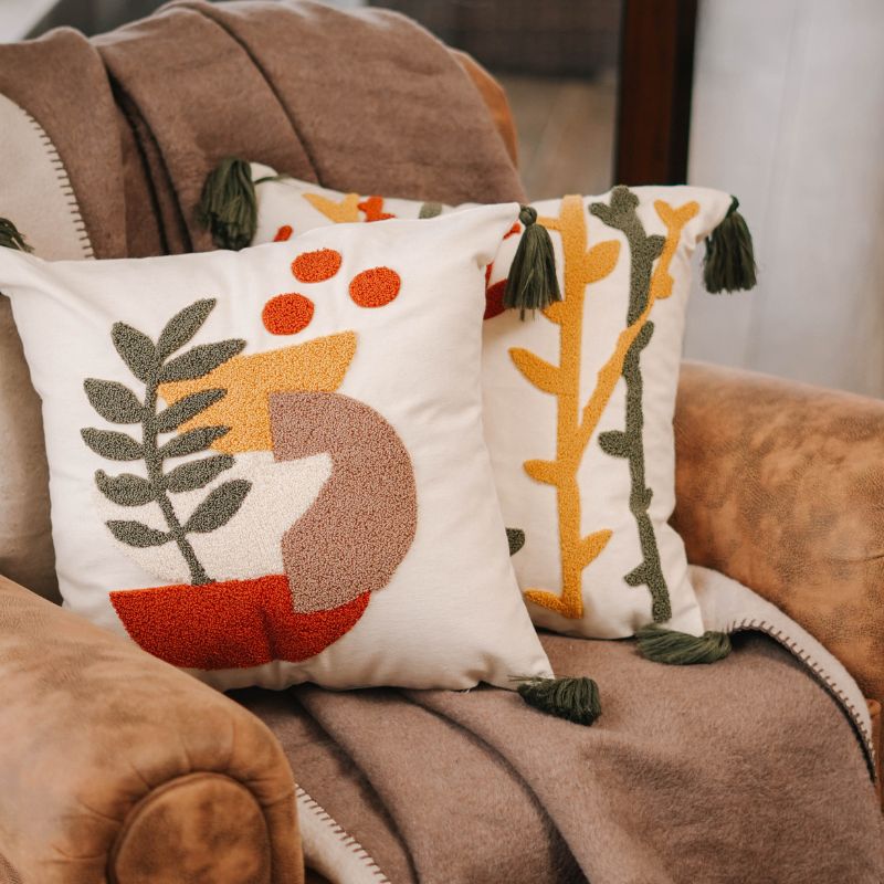 Abstract Garden Collection square cushion cover with embroidered stems in red, mustard yellow, and olive green, finished with green tassels – 43x43 cm decorative pillow